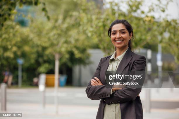 mature businesswoman looking into camera - medium shot stock pictures, royalty-free photos & images