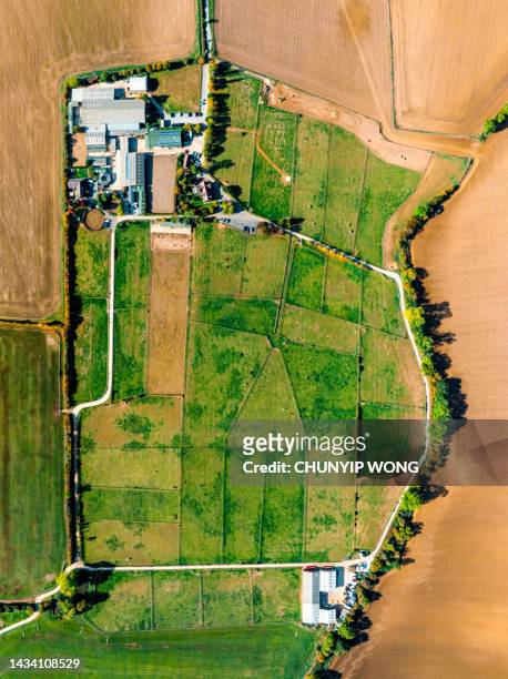 aerial view of farm in uk - farmhouse stock pictures, royalty-free photos & images