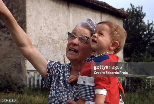 grandmother holding her nephew - 1967 stock pictures, royalty-free photos & images