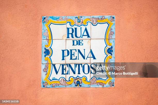 traditional street name sign in porto, portugal - street name sign fotografías e imágenes de stock