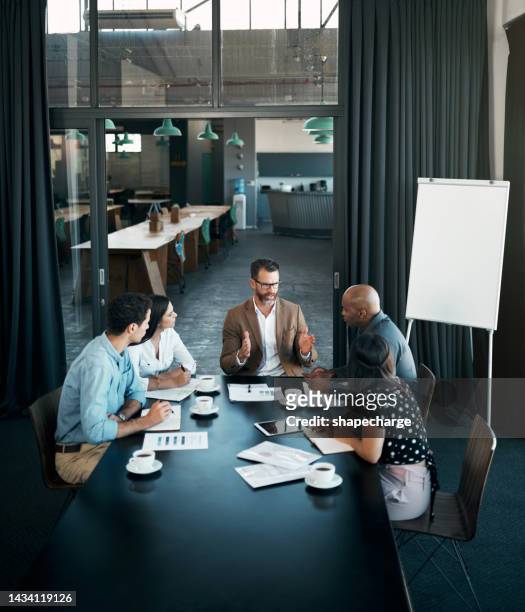 team diversity, business and meeting at table to have conversation for group project, planning or strategy for startup company in office. brainstorming, teamwork and communicate finance in workspace - organised group stock pictures, royalty-free photos & images