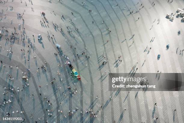 aerial view of tourists in the square at night. - abstract light busy stock pictures, royalty-free photos & images