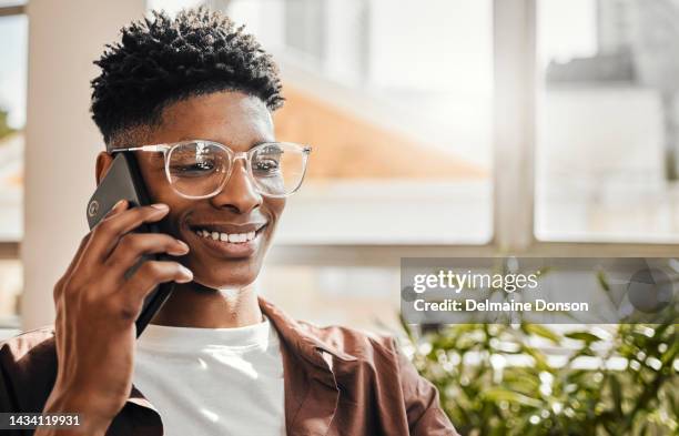 phone call, conversation and black man happy about conversation in a home. mobile communication of a gen z person with technology with a smile talking, speaking and chatting on a cellphone in a house - gen i stock pictures, royalty-free photos & images