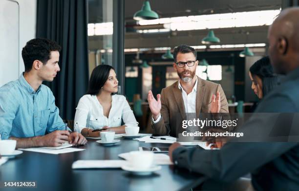 business people, meeting and planning in team conference for marketing strategy, ideas and discussion at the office. group of diverse corporate employee workers in teamwork conversation for sales - senior manager stock pictures, royalty-free photos & images