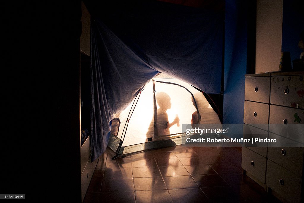 Kids camping indoors.