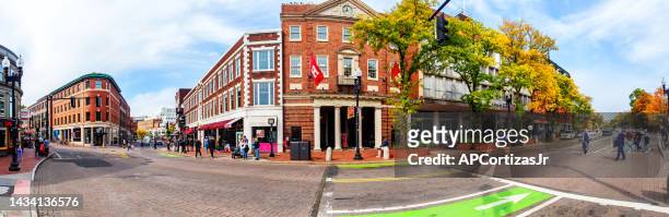 panorama of harvard square on an autumn day - cambridge massachusetts - cambridge street stock pictures, royalty-free photos & images