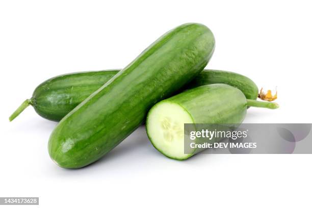 fresh cucumbers isolated on white background - komkommer stockfoto's en -beelden