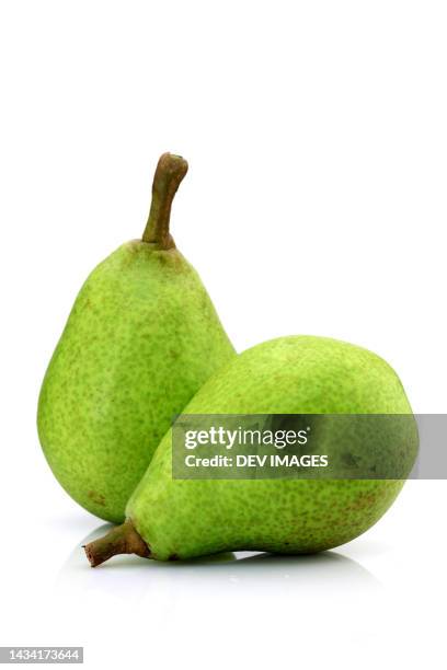 fresh green pears isolated on white - pear stock pictures, royalty-free photos & images