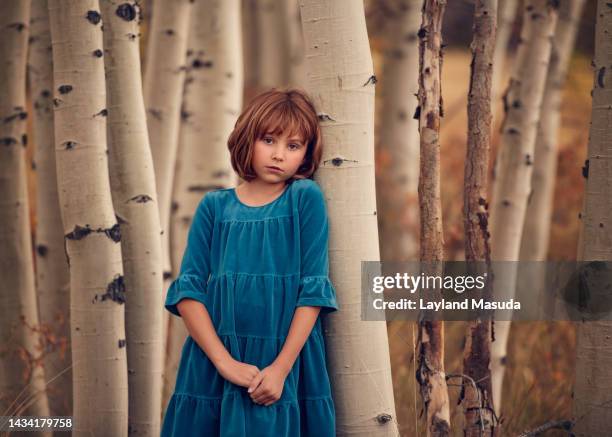 pretty 7 years girl with aspen trees - 6 7 years stock-fotos und bilder