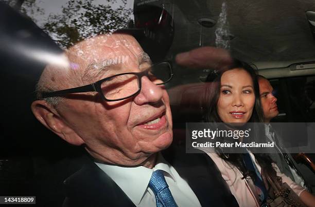 Rupert Murdoch is driven from The Royal Courts of Justice with his wife Wendi Deng Murdoch and son Lachlan after giving evidence to The Leveson...