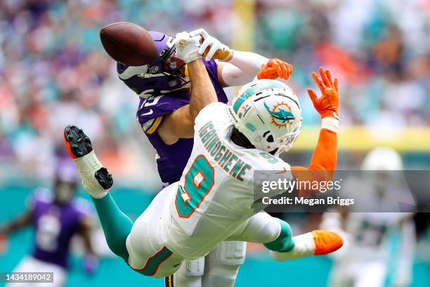 Adam Thielen of the Minnesota Vikings attempts to catch a pass over Noah Igbinoghene of the Miami Dolphins during the third quarter at Hard Rock...