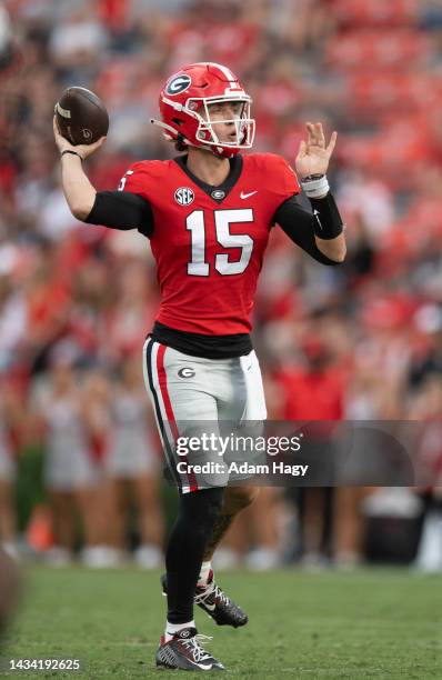 Carson Beck of the Georgia Bulldogs looks to throw against the Vanderbilt Commodores at Sanford Stadium on October 15, 2022 in Athens, Georgia.