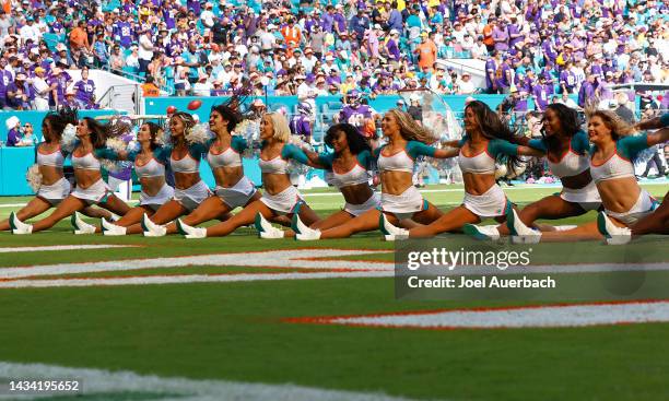 The Miami Dolphins cheerleaders perform during a break in action against the Minnesota Vikings at Hard Rock Stadium on October 16, 2022 in Miami...