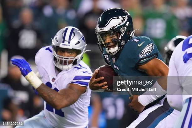 Jalen Hurts of the Philadelphia Eagles runs the ball against Micah Parsons of the Dallas Cowboys at Lincoln Financial Field on October 16, 2022 in...
