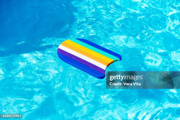 top view of plastic mat floating on swimming pool at summer with water waves - festival float stock pictures, royalty-free photos & images