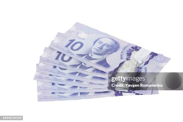 canadian ten dollar bills on a white background - 20 dollar canadian bill stockfoto's en -beelden