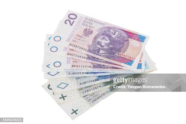 polish zloty on a white background - poland money stock pictures, royalty-free photos & images