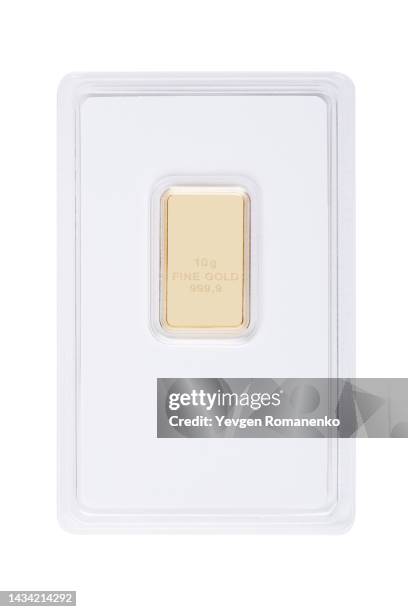 gold ingot in a plastic package on a white background - goldbarren stock-fotos und bilder