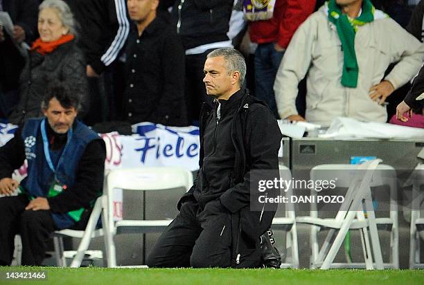 Real Madrid's Portuguese coach Jose Mourinho reacts during the penalty kicks of the UEFA Champions League second leg semi-final football match Real...