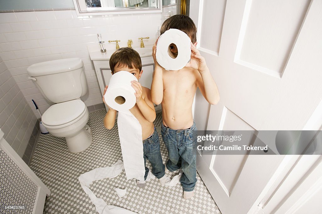 Boys playing with toilet paper