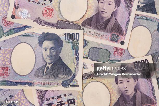 japanese yen as a background - japanese currency - fotografias e filmes do acervo