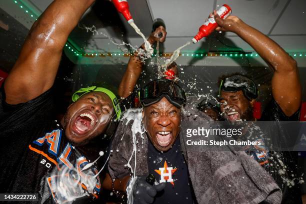 Dusty Baker Jr. #12 of the Houston Astros celebrates alongside Bryan Abreu after defeating the Seattle Mariners 1-0 in game three of the American...