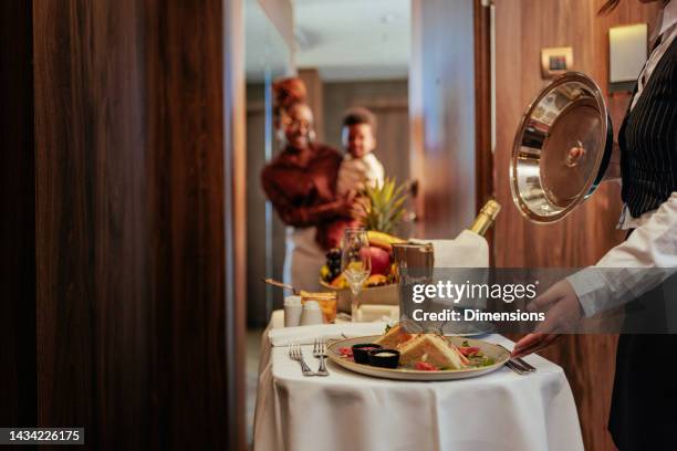 room service at guests door in hotel. - luxury hotel service stock pictures, royalty-free photos & images