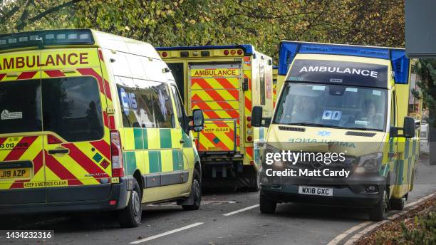 Ambulances queue outside the accident and emergency department of the Bath Royal United Hospital, on October 17, 2022 in Bath, England. The sight of...