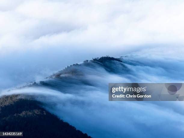 clouds on mountain - sweeping landscape stock pictures, royalty-free photos & images