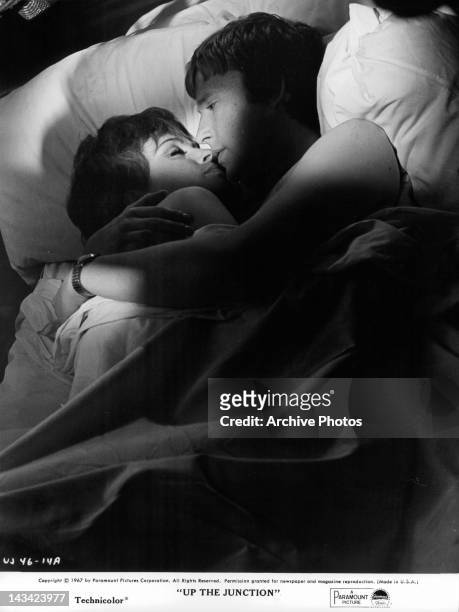 Suzy Kendall and Dennis Waterman in bed together in a scene from the film 'Up The Junction', 1967.