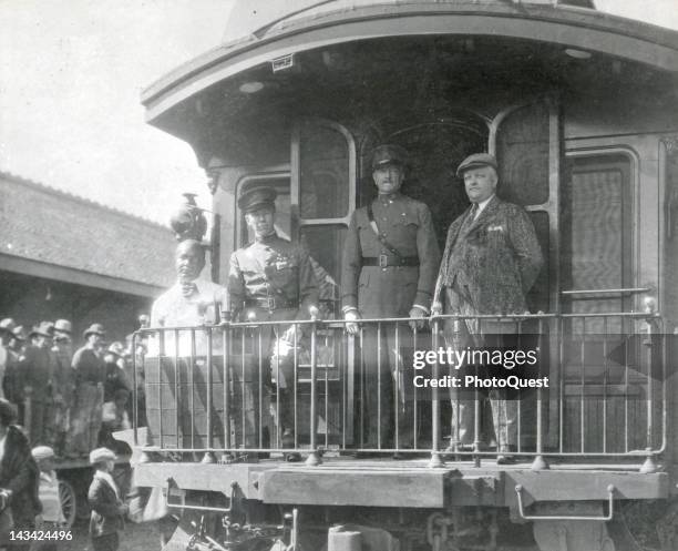 At the end of World War I Colonel George C. Marshall Jr., General John Pershing, and others ride on an observation car, Paris, France, 1918.