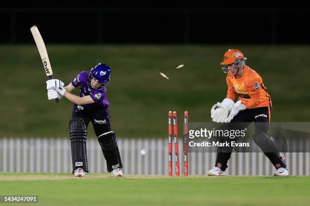 Nicola Carey of the Hurricanes is bowled by Sophie Devine of the Scorchers during the Women's Big Bash League match between the Hobart Hurricanes and...