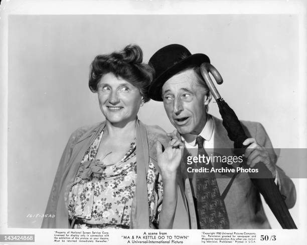 Marjorie Main pointing at umbrella carrying Percy Kilbride in a scene from the film 'Ma and Pa Kettle Go To Town', 1950.