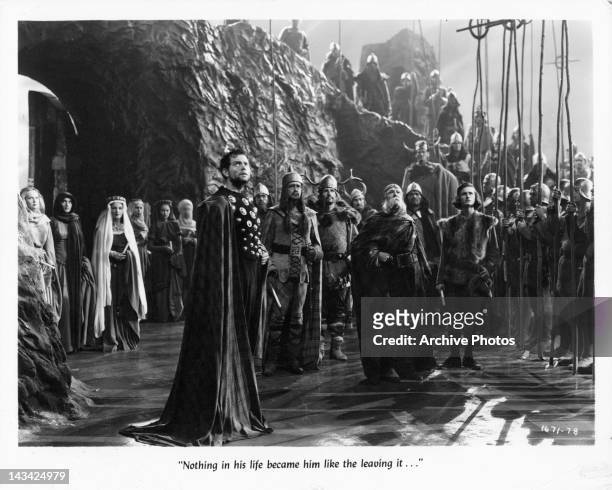 Orson Welles and Roddy McDowall are among a large group looking up in a scene from the film 'Macbeth', 1948.