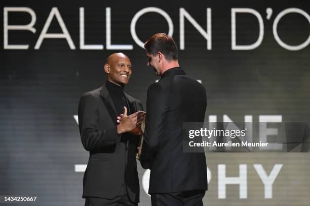 Thibaut Courtois receives the Yashin Trophy for best goalkeeper from Sebastien Haller during the Ballon D'Or ceremony at Theatre Du Chatelet In Paris...