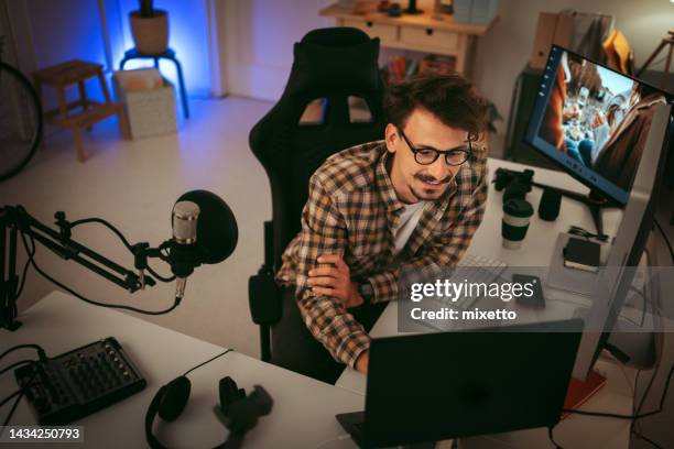 young casually clothed editor working from home office - editing equipment stock pictures, royalty-free photos & images