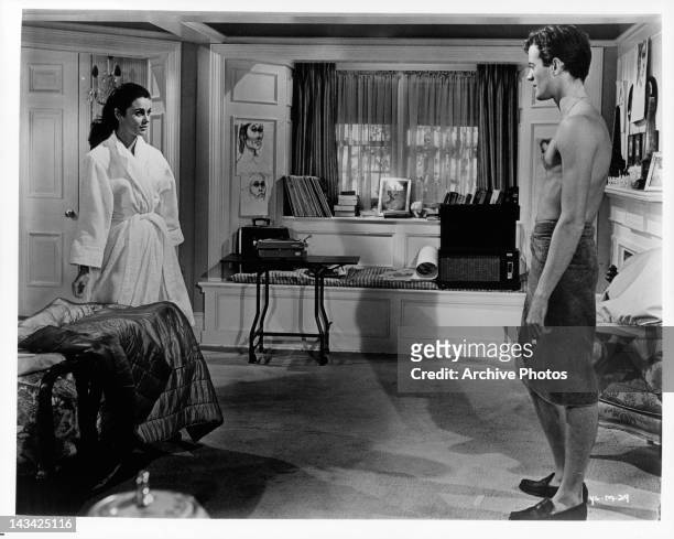 Sharon Hugueny and Peter Fonda in bathrobe and towel in a scene from the film 'The Young Lovers', 1964.