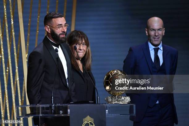 Karim Benzema receives the Ballon d'Or award from Zinedine Zidane next to his mother Malika Benzema during the Ballon D'Or ceremony at Theatre Du...