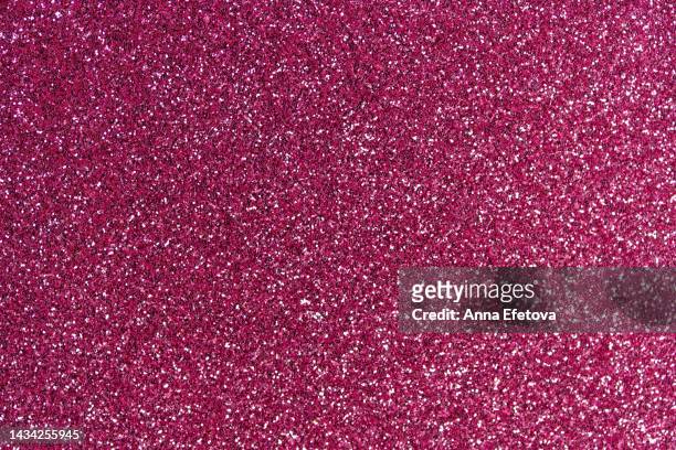 festive pink glittering background. new year and christmas celebration concept. bright backdrop for your design with copy space - knallrosa stock-fotos und bilder