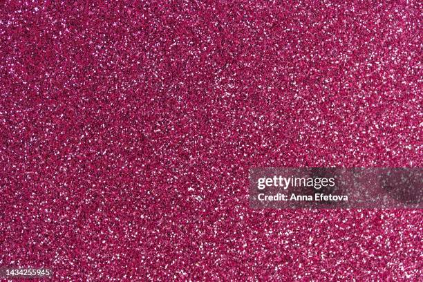 festive pink glittering background. new year and christmas celebration concept. bright backdrop for your design with copy space - warm roze stockfoto's en -beelden