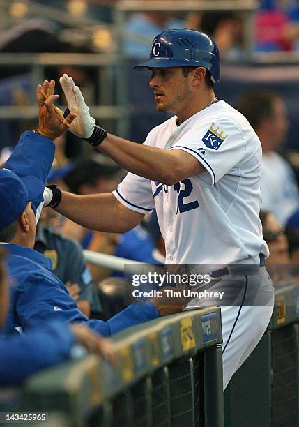 Center fielder Mitch Maier of the Kansas City Royals is congratulated after scoring a run in a game against the Toronto Blue Jays at Kauffman Stadium...