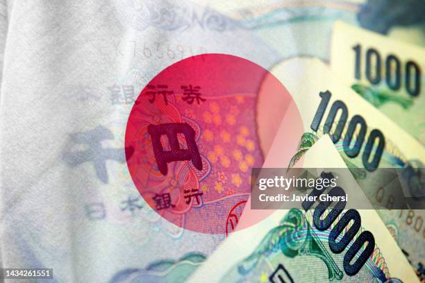 japan flag and japanese yen cash bills - ten thousand yen note ストックフォトと画像