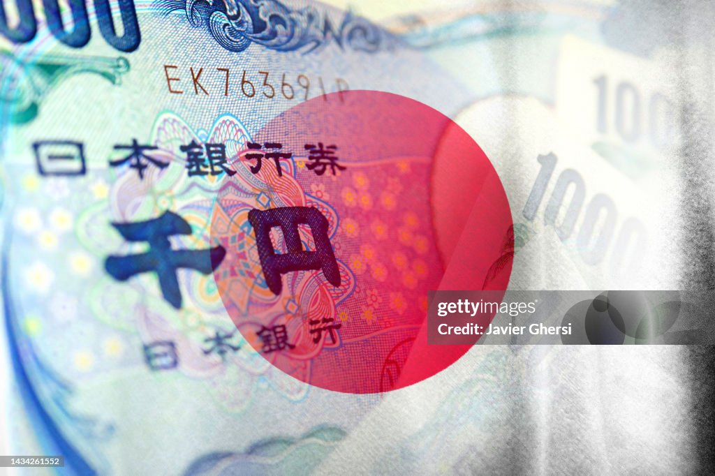 Japan flag and Japanese Yen cash bills