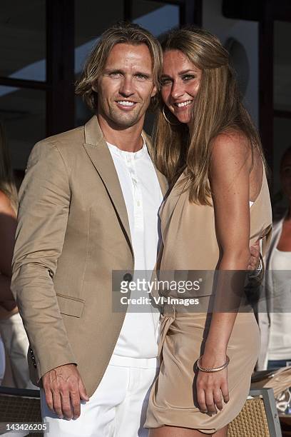 Boudewijn Zenden ,girlfriend Nadine attend the wedding of Dutch football player John Heitinga and Charlotte Sophie Zenden on July 15, 2010 in Ibiza,...