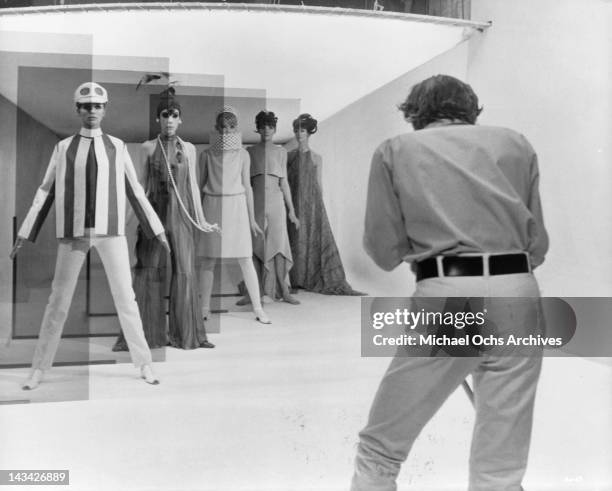 David Hemmings shoots a high fashion session with five models, Jill Kennington, Peggy Moffit, Rosaleen Murray, Ann Norman and Melanie Hampshire in a...
