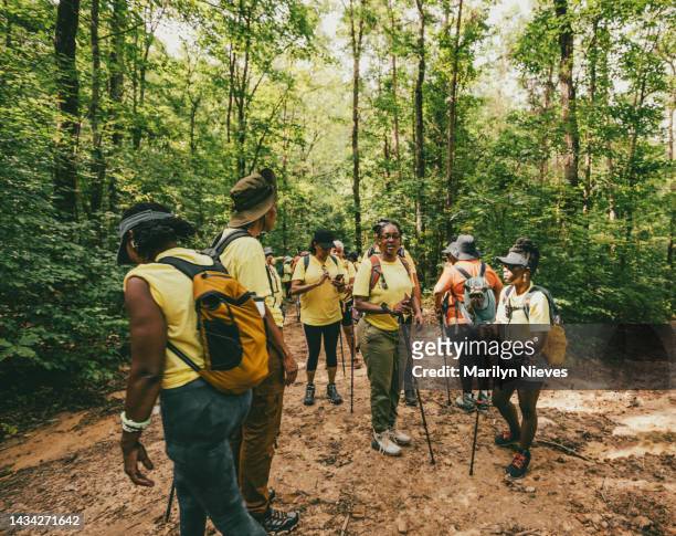 group of women out hiking on the trail - "marilyn nieves" stock pictures, royalty-free photos & images