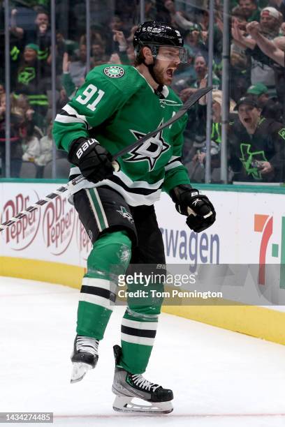 Tyler Seguin of the Dallas Stars celebrates after scoring a goal against Connor Hellebuyck of the Winnipeg Jets in the first period at American...