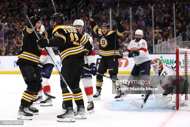 Greer of the Boston Bruins celebrates with Charlie Coyle after scoring a goal against the Florida Panthers during the third period at TD Garden on...