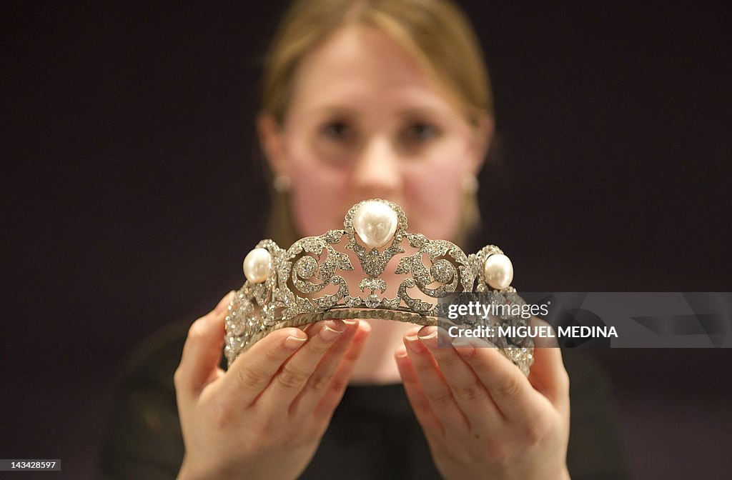 A model holds The Murat Tiara, a pearl a