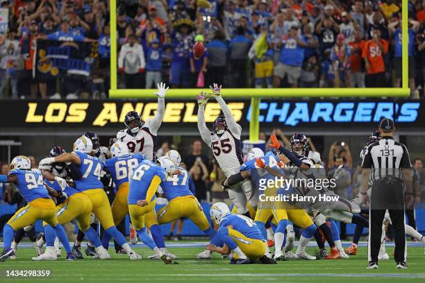 Dustin Hopkins of the Los Angeles Chargers kicks the game winning field goal in overtime to defeat the Denver Broncos at SoFi Stadium on October 17,...